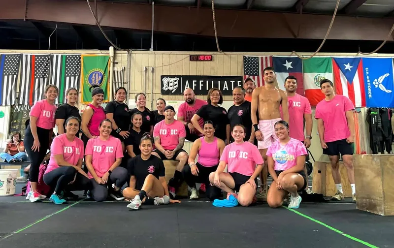 The Toxic Fitness Mayhem Affiliate crew together with flags